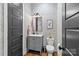 Chic powder room with patterned wallpaper, a modern vanity, and stylish fixtures, creating a sophisticated space at 2615 Chesterfield Ave, Charlotte, NC 28205