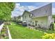 Expansive backyard features a manicured lawn, patio area, and privacy fence, perfect for entertaining at 2630 Mary Butler Way, Charlotte, NC 28226
