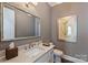 Bathroom featuring a large mirror, vanity with marble countertops, and stylish decor at 2630 Mary Butler Way, Charlotte, NC 28226