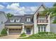 Charming home featuring neutral brick, balcony and inviting entrance with manicured landscaping at 2630 Mary Butler Way, Charlotte, NC 28226