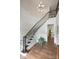Stunning foyer featuring curved staircase, hardwood floors, chandelier, and abundant natural light at 2630 Mary Butler Way, Charlotte, NC 28226