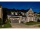 Stunning home exterior features a modern design, well-kept landscaping, and a two-car garage at 2630 Mary Butler Way, Charlotte, NC 28226