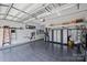 Well-organized garage with cabinets, overhead storage, and durable tile flooring at 2630 Mary Butler Way, Charlotte, NC 28226