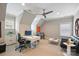 Spacious home office with a ceiling fan, modern desk, and comfortable seating area at 2630 Mary Butler Way, Charlotte, NC 28226