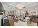 Inviting living space open to dining and kitchen with hardwood floors, coffered ceiling, and natural light at 2630 Mary Butler Way, Charlotte, NC 28226