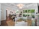 Bright living room with coffered ceilings, hardwood floors, open access to kitchen, and outdoor patio views at 2630 Mary Butler Way, Charlotte, NC 28226