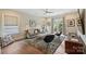 Inviting living room featuring hardwood floors, a plush rug and stylish furnishings at 2630 Mary Butler Way, Charlotte, NC 28226