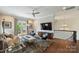 Spacious living room with hardwood floors, stylish furnishings and access to an outdoor balcony at 2630 Mary Butler Way, Charlotte, NC 28226
