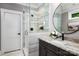 Modern bathroom features a sleek glass-enclosed shower, elegant vanity with granite countertop, and contemporary fixtures at 301 Riverwood Rd, Mooresville, NC 28117