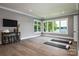 Bright bonus room with stunning lake views features contemporary design and a versatile layout for recreation or relaxation at 301 Riverwood Rd, Mooresville, NC 28117