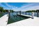 Private boat dock featuring a lift on a calm lake at 301 Riverwood Rd, Mooresville, NC 28117