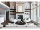 Elegant living room featuring a stone fireplace and open shelving at 301 Riverwood Rd, Mooresville, NC 28117