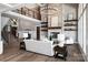 Open living area featuring a stone fireplace, hardwood floors, and modern finishes at 301 Riverwood Rd, Mooresville, NC 28117