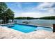 Incredible backyard pool and jacuzzi with stunning lake views at 301 Riverwood Rd, Mooresville, NC 28117