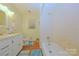 Standard bathroom featuring a single vanity, toilet, and tiled shower/tub combo at 3016 Boston Ave, Charlotte, NC 28212