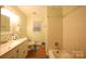Standard bathroom featuring a single vanity, toilet, and tiled shower/tub combo at 3016 Boston Ave, Charlotte, NC 28212