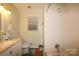 Neutral bathroom featuring a vanity with storage and a shower/tub combo at 3016 Boston Ave, Charlotte, NC 28212
