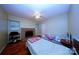 Cozy bedroom with two twin beds and a decorative fireplace at 3016 Boston Ave, Charlotte, NC 28212