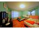 A tidy bedroom is brightly lit with two beds and wood floors at 3016 Boston Ave, Charlotte, NC 28212
