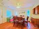 Dining room with hardwood floors, large windows, and a ceiling fan at 3016 Boston Ave, Charlotte, NC 28212
