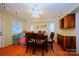 Traditional dining room with hardwood floors, a ceiling fan and a large window at 3016 Boston Ave, Charlotte, NC 28212