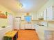 Bright kitchen featuring white cabinets, white appliances and room for a small table at 3016 Boston Ave, Charlotte, NC 28212