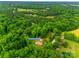 A captivating aerial view of the wooded property with mature trees and a serene setting at 3988 Old Hickory Rd, Lancaster, SC 29720