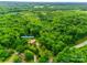 Aerial perspective reveals this home's secluded position amongst dense, mature trees at 3988 Old Hickory Rd, Lancaster, SC 29720