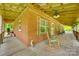 Spacious porch with rocking chairs, and views of nature provides a peaceful retreat at 3988 Old Hickory Rd, Lancaster, SC 29720