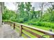 Wooden porch overlooking the lush backyard provides a serene outdoor space at 3988 Old Hickory Rd, Lancaster, SC 29720