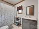 Cozy bathroom features a granite vanity top and decorative shower curtain at 3988 Old Hickory Rd, Lancaster, SC 29720
