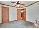 Neutral bedroom with ceiling fan, and doorway to kitchen, plus two closets at 3988 Old Hickory Rd, Lancaster, SC 29720
