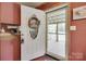 Welcoming front entrance featuring a white door with decorative glass and a cozy interior view at 3988 Old Hickory Rd, Lancaster, SC 29720