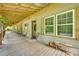 Inviting covered front porch with wood flooring, comfortable seating, and views of the surrounding landscape at 3988 Old Hickory Rd, Lancaster, SC 29720