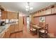 Eat-in kitchen features wood cabinets, lots of decorations, and a spacious dining area at 3988 Old Hickory Rd, Lancaster, SC 29720