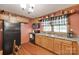 Well-equipped kitchen featuring light wood cabinets, modern appliances, and charming country-style decor at 3988 Old Hickory Rd, Lancaster, SC 29720