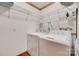 Functional laundry room with washer, dryer, and white wire shelving at 3988 Old Hickory Rd, Lancaster, SC 29720