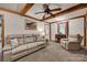 Relaxing living room with exposed wood beams, lots of seating, and natural light at 3988 Old Hickory Rd, Lancaster, SC 29720