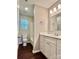 Bathroom featuring a modern vanity with a white countertop, chrome fixtures, and white tub at 4504 Bellmore Ct, Charlotte, NC 28269