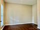 A bright bedroom features hardwood floors and a window at 4504 Bellmore Ct, Charlotte, NC 28269