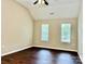 Inviting bedroom with a ceiling fan and natural light from two windows at 4504 Bellmore Ct, Charlotte, NC 28269