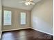 Bright bedroom with hardwood flooring and natural light from two windows at 4504 Bellmore Ct, Charlotte, NC 28269