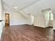 Spacious bonus room featuring wood-look floors and unique architectural details at 4504 Bellmore Ct, Charlotte, NC 28269