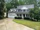 Charming two-story home boasts a two-car garage, dark shutters, and a welcoming front porch at 4504 Bellmore Ct, Charlotte, NC 28269