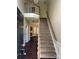 Entryway with a staircase leading to the second floor and hardwood floors throughout the downstairs at 4504 Bellmore Ct, Charlotte, NC 28269