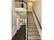 Grand foyer with staircase, dark wood flooring, and natural light flooding the home at 4504 Bellmore Ct, Charlotte, NC 28269