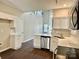 Bright kitchen featuring white cabinets and countertops with stainless steel appliances at 4504 Bellmore Ct, Charlotte, NC 28269