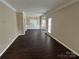 Spacious living room featuring beautiful hardwood floors and plenty of natural light at 4504 Bellmore Ct, Charlotte, NC 28269