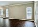 Bright and airy living room with hardwood floors and multiple windows at 4504 Bellmore Ct, Charlotte, NC 28269