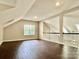 The loft offers natural light and hardwood floors at 4504 Bellmore Ct, Charlotte, NC 28269